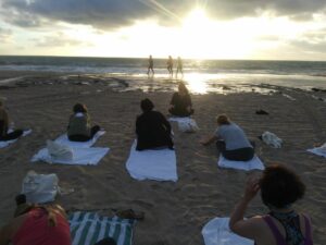 View of yoga class watching the sunset