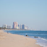 View of the beach and city buildings