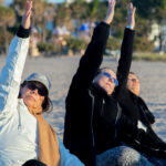 Three yoga students doing yoga positions