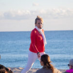 View of woman walking around the yoga class