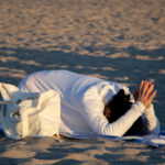 View of woman doing yoga position