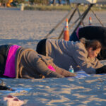 Side view of students doing yoga positions