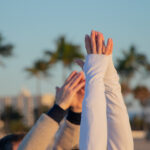 View of hands doing yoga